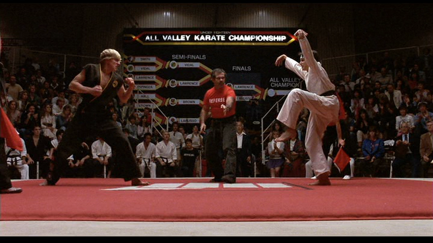 The-Karate-Kid-William-Zabka-Ralph-Macchio-crane-kick-tournament.png
